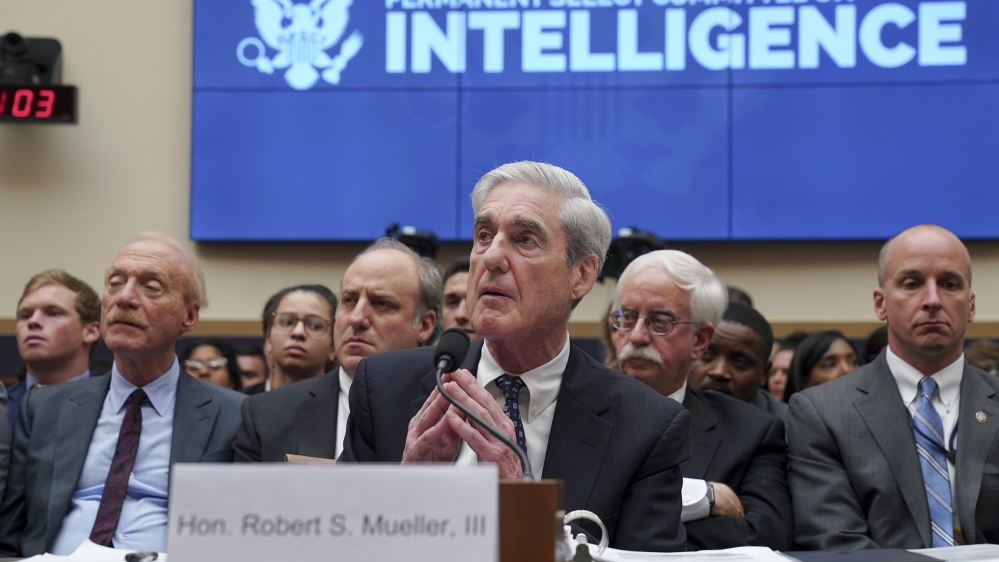 Former Special Counsel Robert Mueller testifies before the House Intelligence Committee during a hearing about Russian interference into the 2016 election and possible efforts by Trump to obstruct Mueller’s investigation