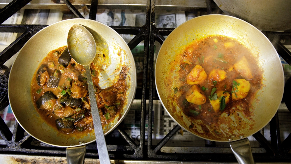 Vegan meals are cooked in the kitchen of the City Spice curry house restaurant on Brick Lane in London, Britain January 7, 2019
