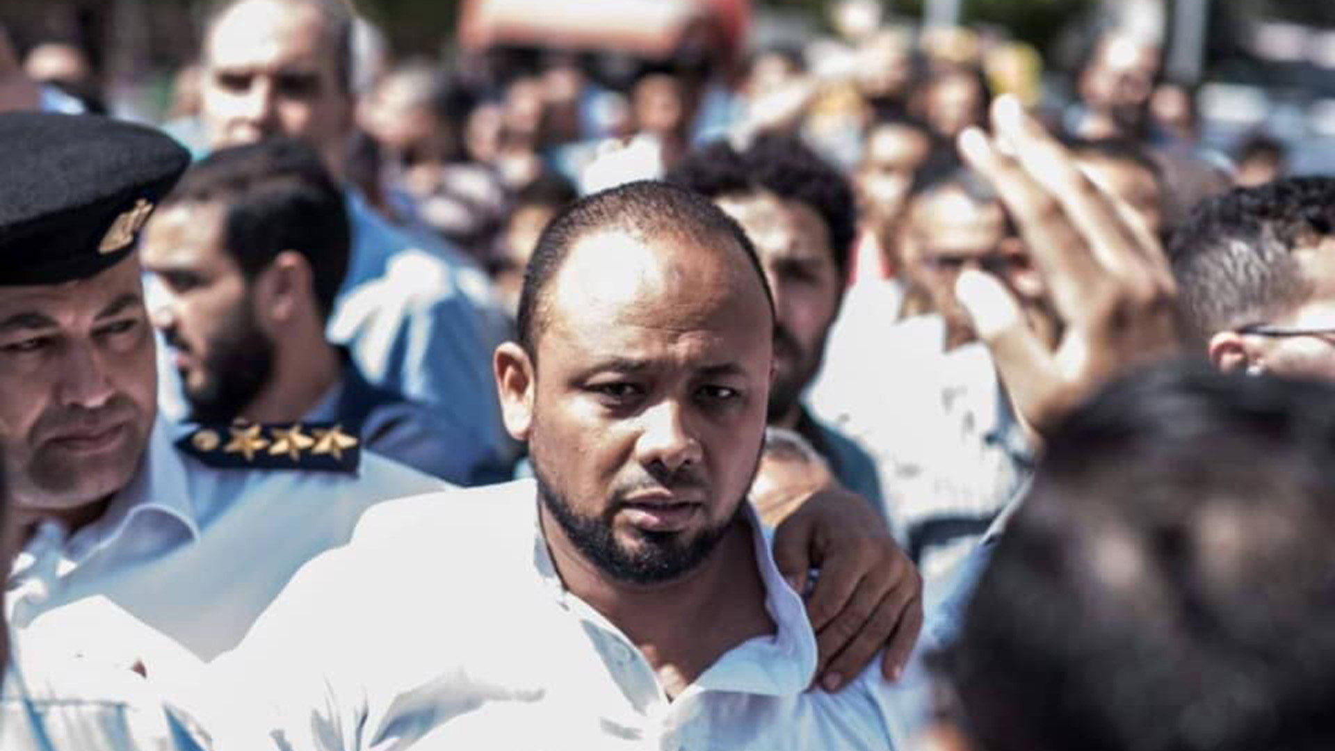 Mohamed el-Baqer attends his father’s funeral on 18 October 2019. He died while his son was in detention [Al Jazeera]