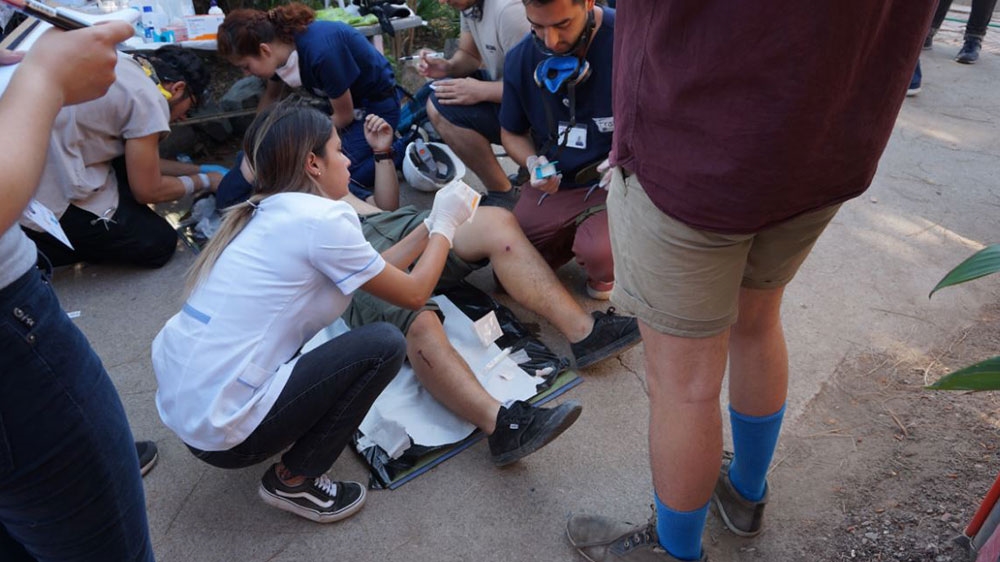 Volunteer medics attend to a wounded protester in Santiago