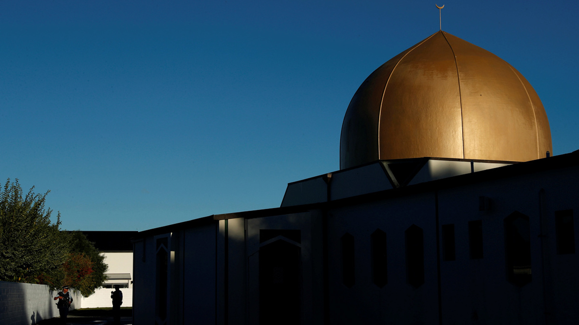 Armed police officers stand guard outside Al Noor mosque on April 1, 2019