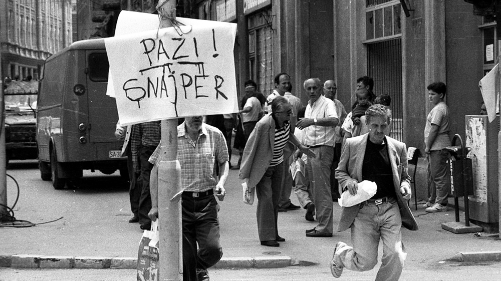 A sign in Sarajevo warns pedestrians crossing the streets: ‘Watch out! Sniper!’
