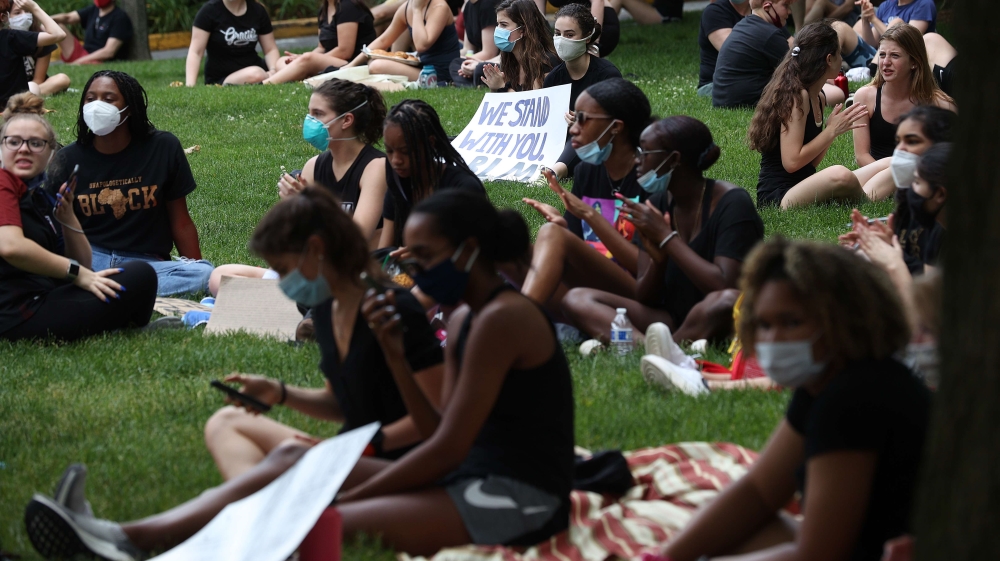 Students participate in a Black Lives Matter sit-in at the National Cathedral during a peaceful protest against police brutality and the killing of George Floyd, in Washington, DC on June 5, 2020