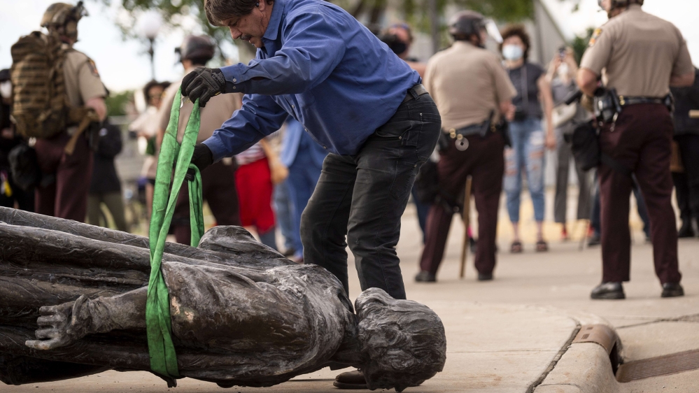 A statue of Christopher Columbus, which was toppled to the ground by protesters, is loaded onto a truck on the grounds of the State Capitol on June 10, 2020, in St Paul, Minnesota. The protest was led by Mike Forcia, a member of the Bad River Band of Lake Superior Chippewa, who called the statue a symbol of genocide
