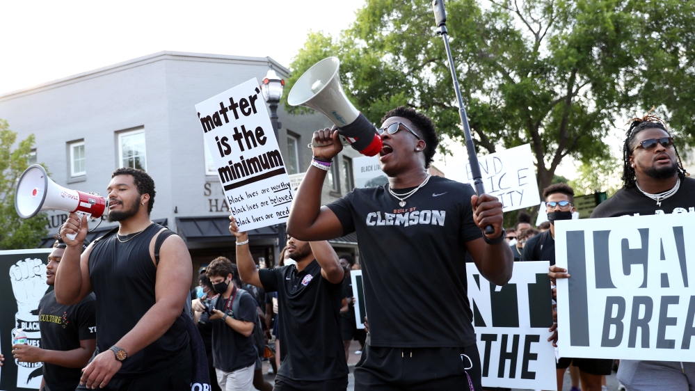 Clemson football players lead a “March for Change” protest on the campus of Clemson University in South Carolina on June 13, 2020